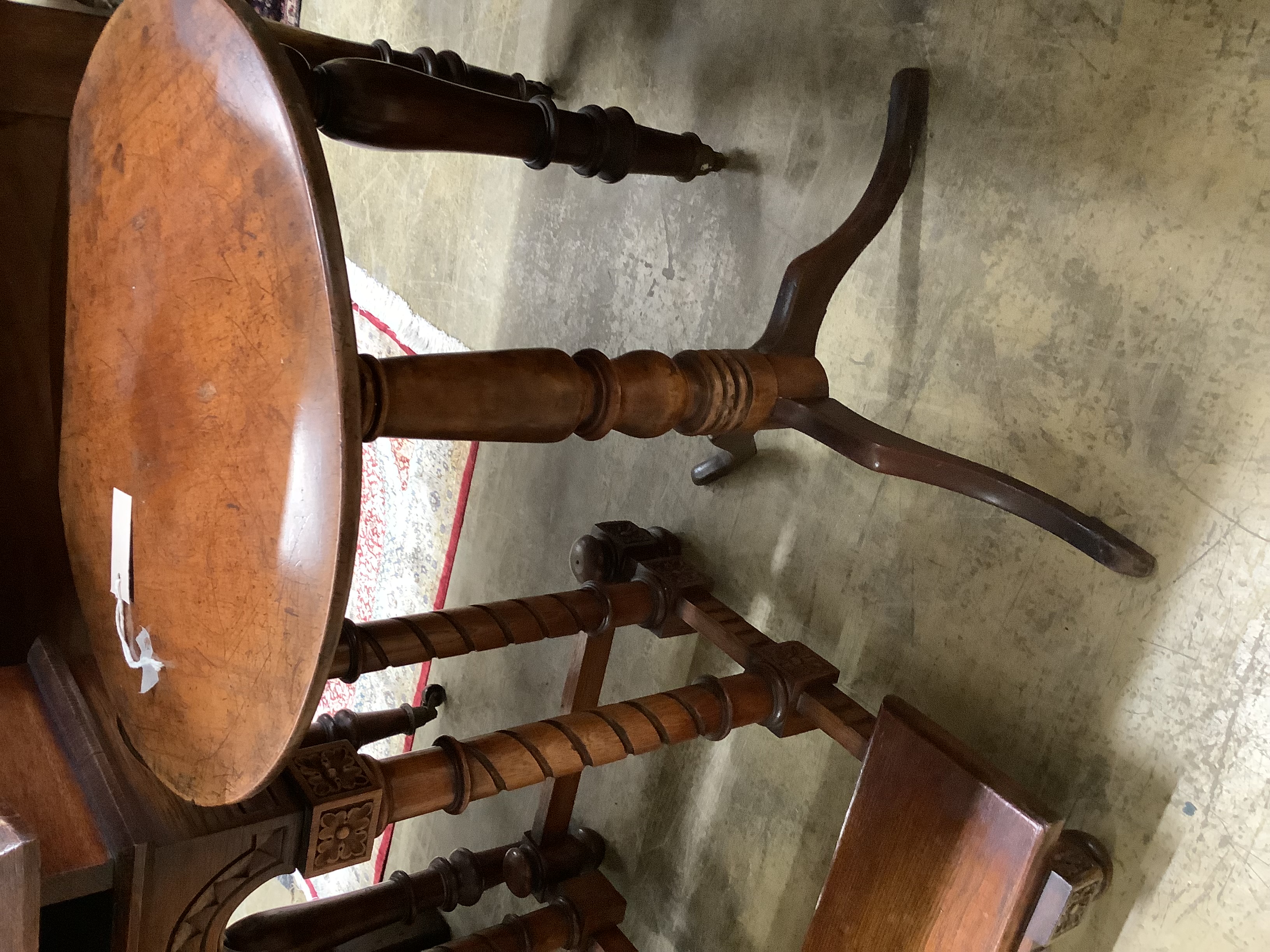 A Gothic style carved oak prie-dieu, width 64cm, height 82cm together with a 19th century circular mahogany tripod table, diameter 47cm